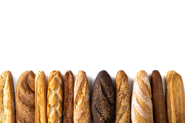 grupo de pão baguette em uma variedade de fileiras - carbohydrate artisan bread isolated on white isolated - fotografias e filmes do acervo