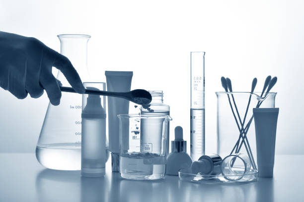 istock Dermatologist formulating and mixing pharmaceutical skincare, Cosmetic bottle containers and scientific glassware, Research and develop beauty product concept. 1203733287