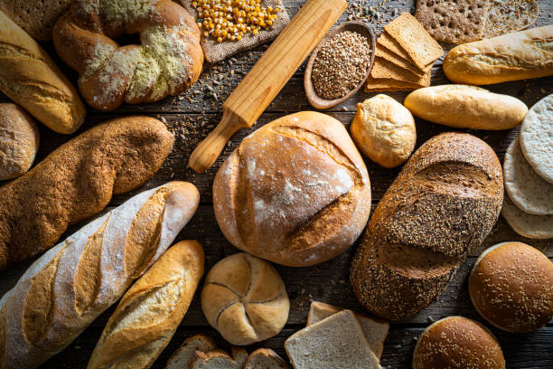 istock Bread varied bakery traditional on rustic wood 1203733358