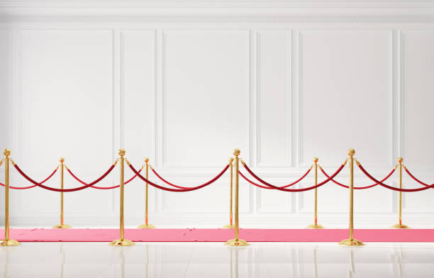 istock Classic luxury interior with white wall and event carpet with golden barrier 1203733710