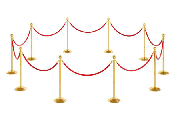istock Golden barrier with red rope isolated on white background. Clipping path included 1203733729