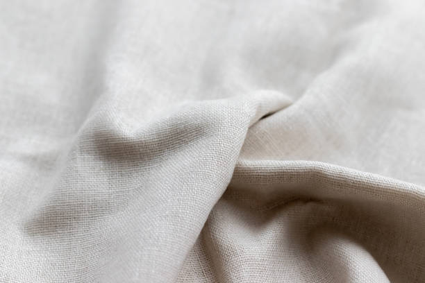 istock Natural linen fabric texture. Rough crumpled burlap background. Selective focus. Closeup view 1203734587