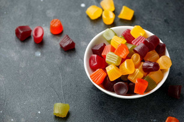 A mix of Midget Gems candy in white bowl. sweet food A mix of Midget Gems candy in white bowl. sweet food. gum drop photos stock pictures, royalty-free photos & images