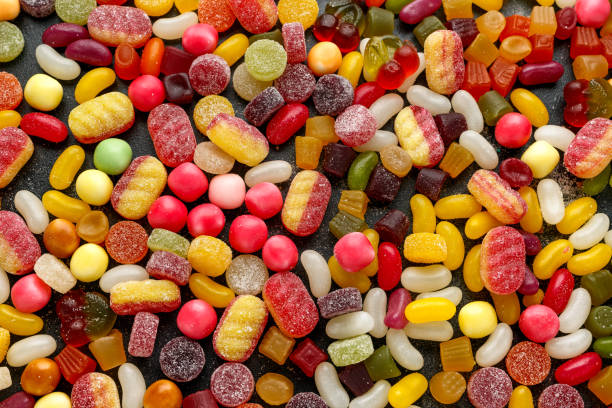 istock A mix of colorful candy on background, texture 1203735428