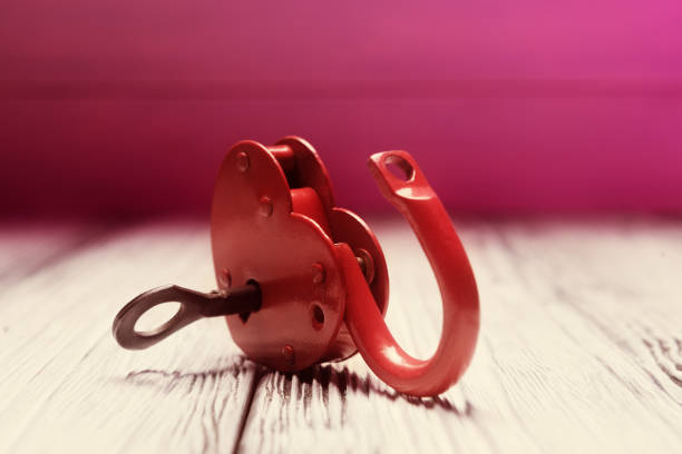 Open heart shaped padlock with key. Love and freedom concept
