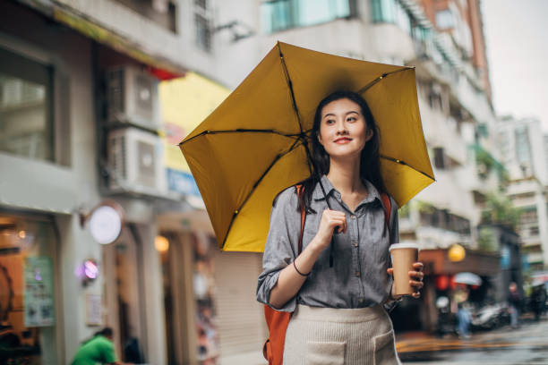 istock Young woman on a rainy day 1203736604