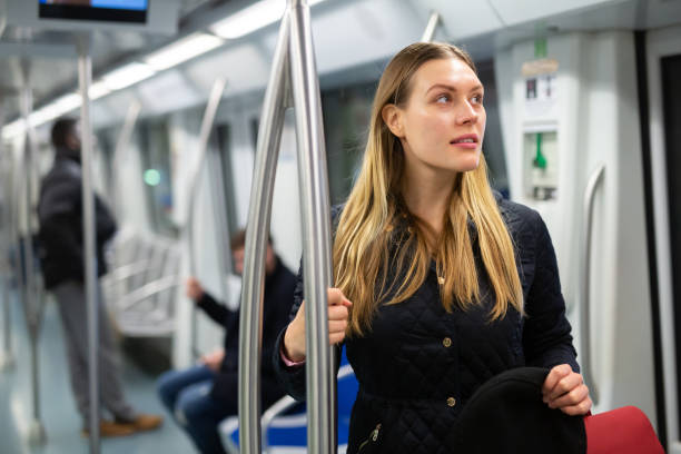 istock Young woman in subway car 1203741182
