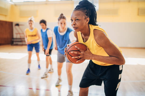 istock Basketball team practicing on basketball court 1203742172