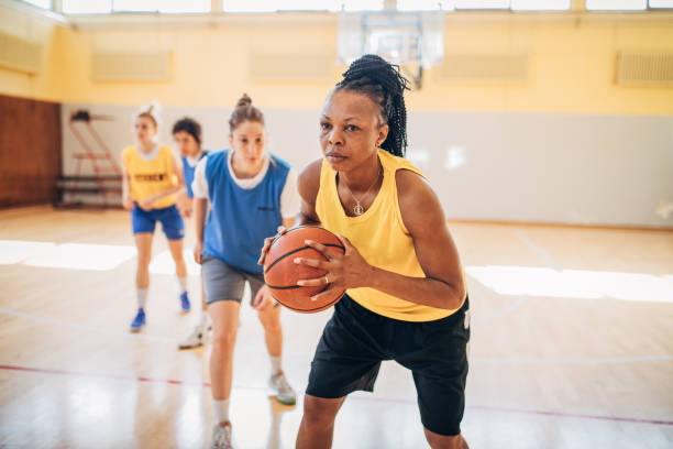 istock Basketball team practicing on basketball court 1203742304