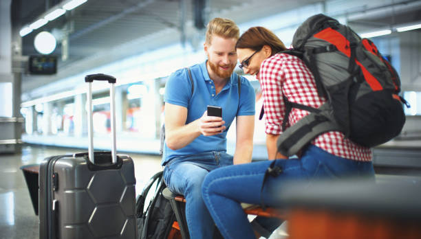 istock Young couple waiting for a train. 1203745265