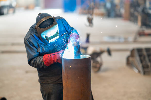 istock Welder in the factory 1203748058