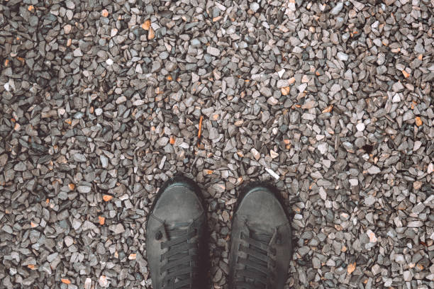 istock Standing on gravel stone ground 1203748085