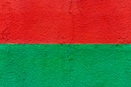 Red and green wall surface as background