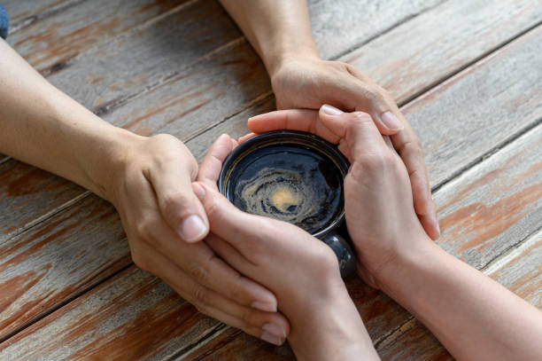 hands  lovers holding a hot cup of coffee, selective focus Valentine's Day. love. Selective focus.