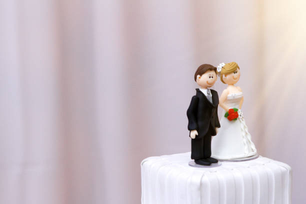 istock beautiful statues of bride and groom decorative wedding cake 1203749732