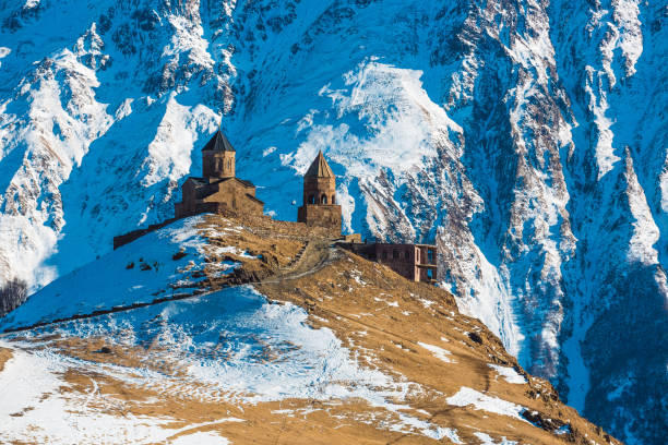 istock Gergeti Trinity Church in Stepantsminda, Georgia 1203751304