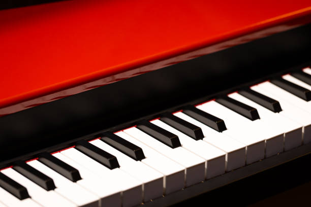 istock red grand piano, music background 1203751313