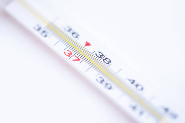 istock Close-up medical mercury thermometer on the white background. 1203752877