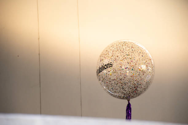 istock Meaningful balloon with congratulation text with tassel in the graduation ceremony. 1203754659