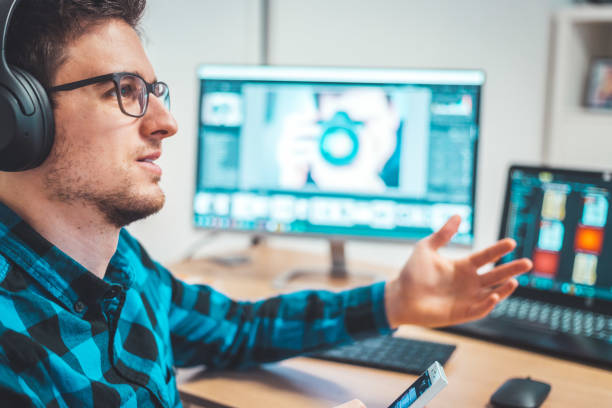 istock Young freelancer is sitting in his home office and working on a creative project 1203756280