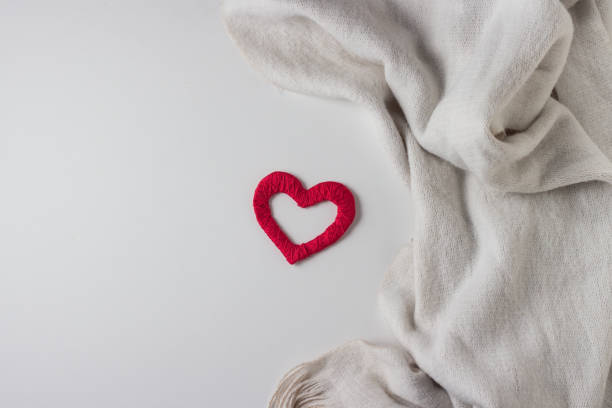 istock Scarf and Red Heart Handmade on White background. Copy space. Flat, top view 1203756403