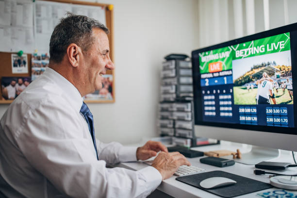 istock One senior man sitting in office and live betting 1203757457