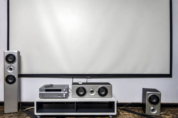istock Home cinema. Large white screen home theater system with stereo 1203758051