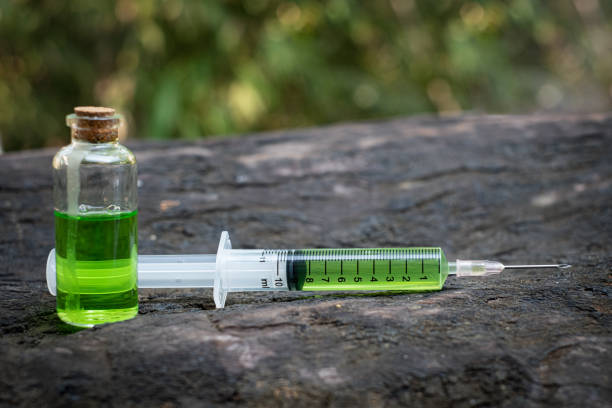 istock Syringe there is medicine inside on table old wood 1203758309