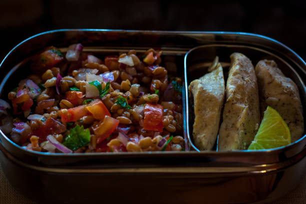 istock Lunchbox with lentil salad and grill chicken breast 1203762560