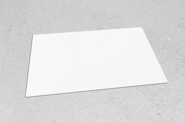 istock empty white rectangle poster mockup lying diagonally on neutral grey concrete background 1203762940