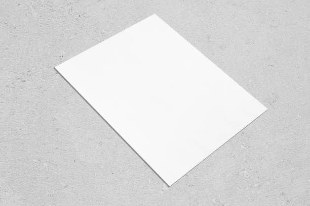 istock empty white rectangle poster mockup lying diagonally on neutral grey concrete background 1203763257