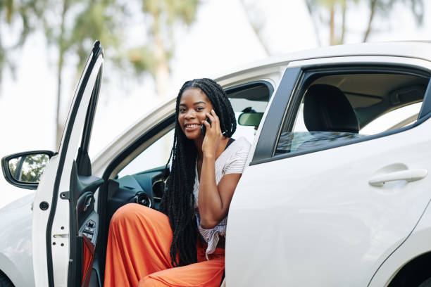 istock Female driver talking on phone 1203764850
