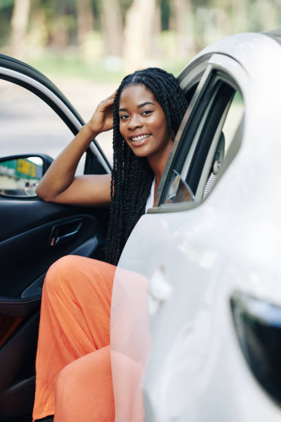 istock Pretty woman in her car 1203764862