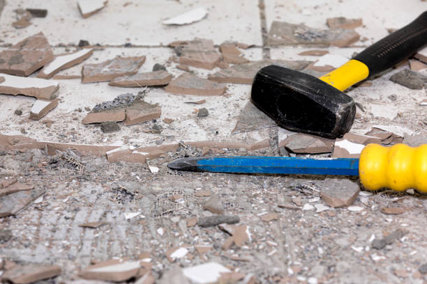 Broken pieces of ceramic tile flooring being removed with hammer and chisel. Concept of DYI home maintenance, repair, remodeling closeup, no people, copy space chisel photos stock pictures, royalty-free photos & images