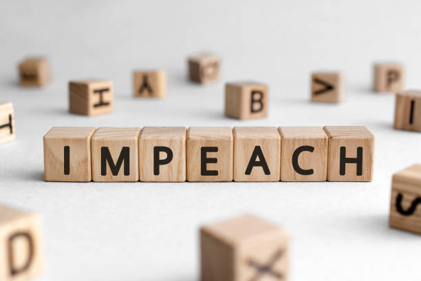 istock Impeach - words from wooden blocks with letters 1203765103