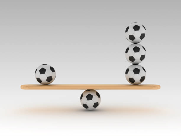 istock Seesaw Scale with Soccer Balls - 3D Rendering 1203765196