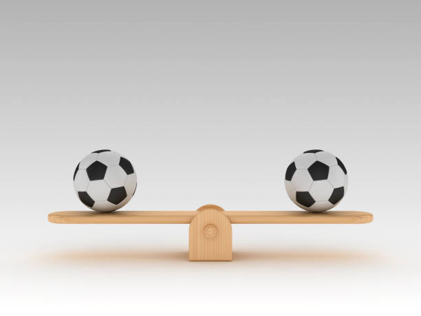 istock Seesaw Scale with Soccer Balls - 3D Rendering 1203765248