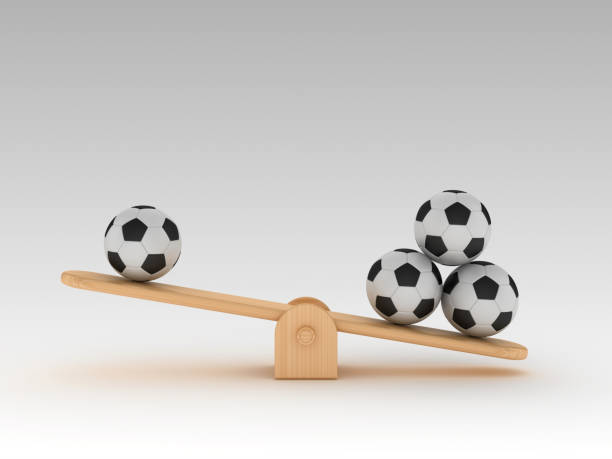 istock Seesaw Scale with Soccer Balls - 3D Rendering 1203765834