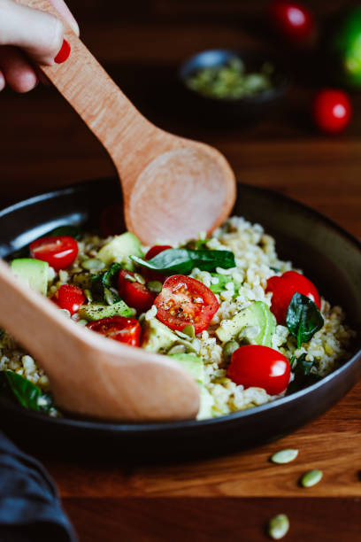 istock Healthy salad with bulgur, avocado, spinach and cherry tomatoes. 1203766299
