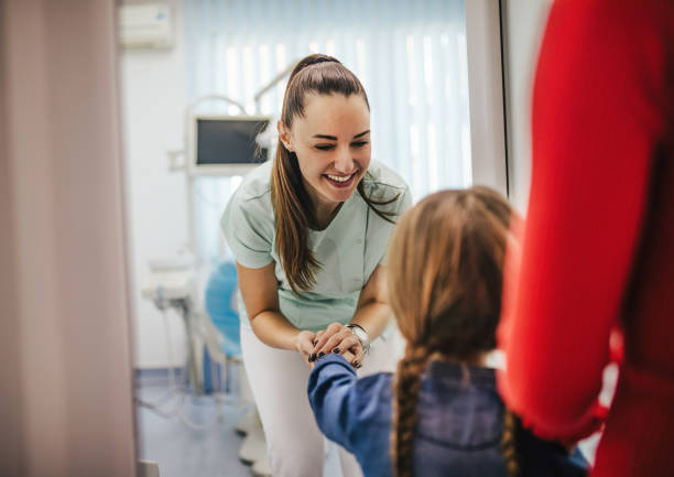 Cute girl teeth checkup at dentist's office