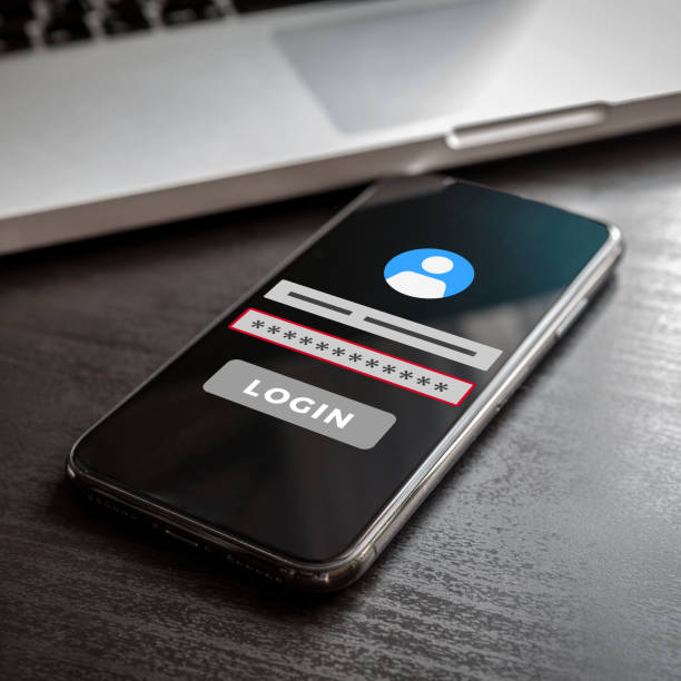 istock Mobile phone with login page on screen and wrong password error or invalid account name. Login page with failure, denied red form on smartphone display 1203769273