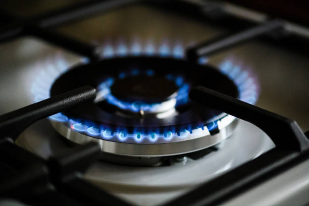istock Natural gas burning on kitchen gas stove 1203770344