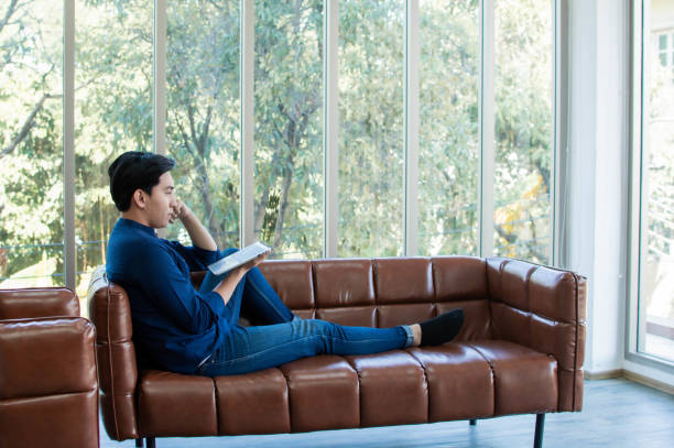 istock A man is using tablet for working in living room 1203770554