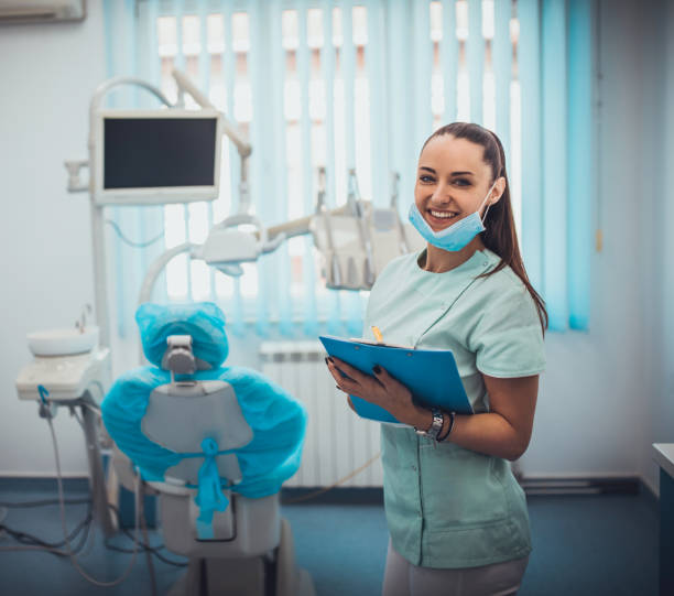 istock Cute girl teeth checkup at dentist's office 1203771365