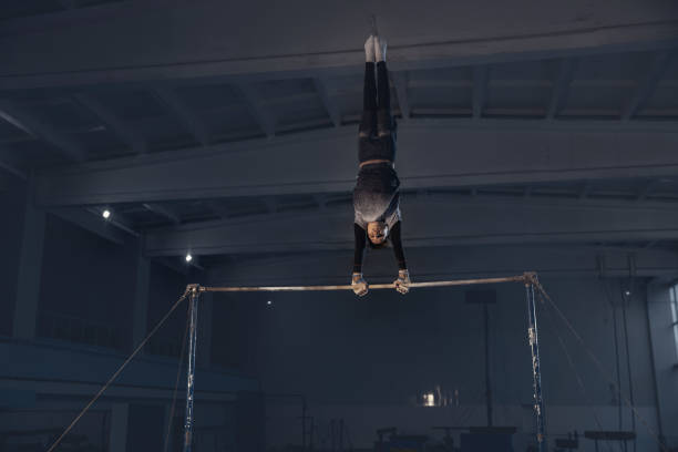 istock Little male gymnast training in gym, flexible and active 1203774584