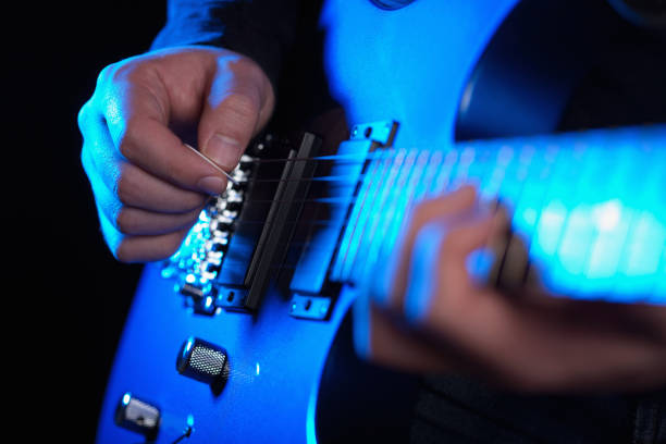istock musician rock guitarist playing a blue guitar 1203774779
