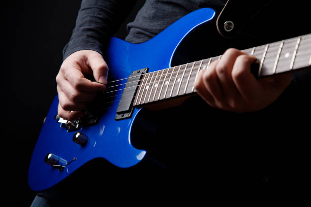 istock musician rock guitarist playing a blue guitar 1203774894