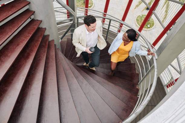 istock Talking young business colleagues 1203775631