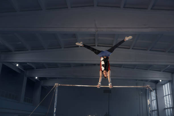 istock Little male gymnast training in gym, flexible and active 1203775678