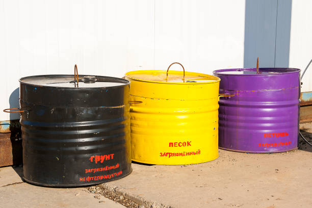 istock Tanks with inscriptions:  oil contaminated soil, contaminated sand, contaminated rags 1203775731